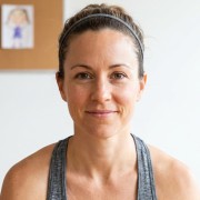 Smiling woman with brown hair pulled back